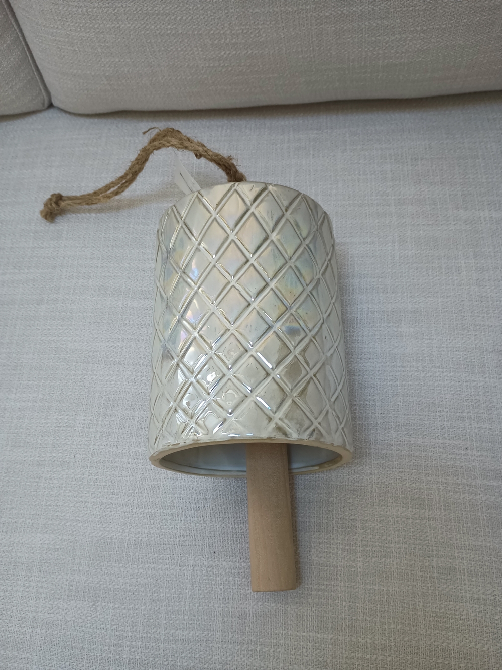 Room & Retreat Cream Luster Ceramic Hanging Bell with Natural Wood Accent